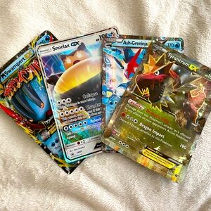 Lot of four oversized Pokemon Collectable Cards